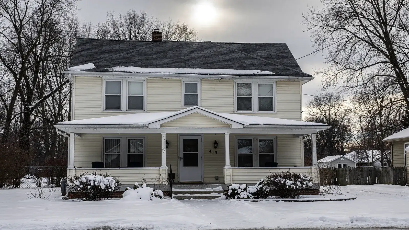 A southwest Michigan house with a new shingle roof in winter